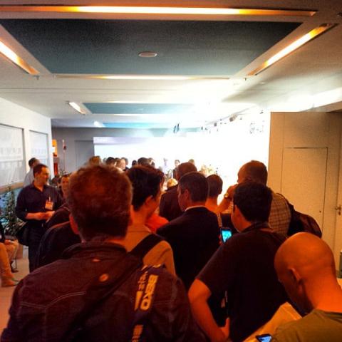 So many suits and it's not even 10am. This is the coffee queue. by Scott Joyce