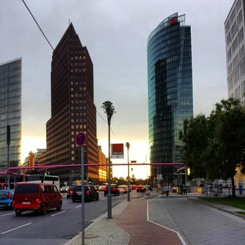 "As night falls over the city, the last sun kissing the tips of  by Scott Joyce